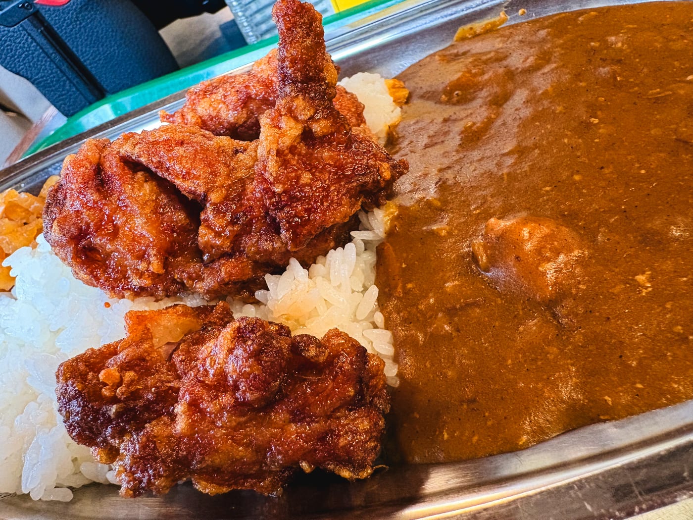 Curry rice topped with large pieces of Chinese Chicken