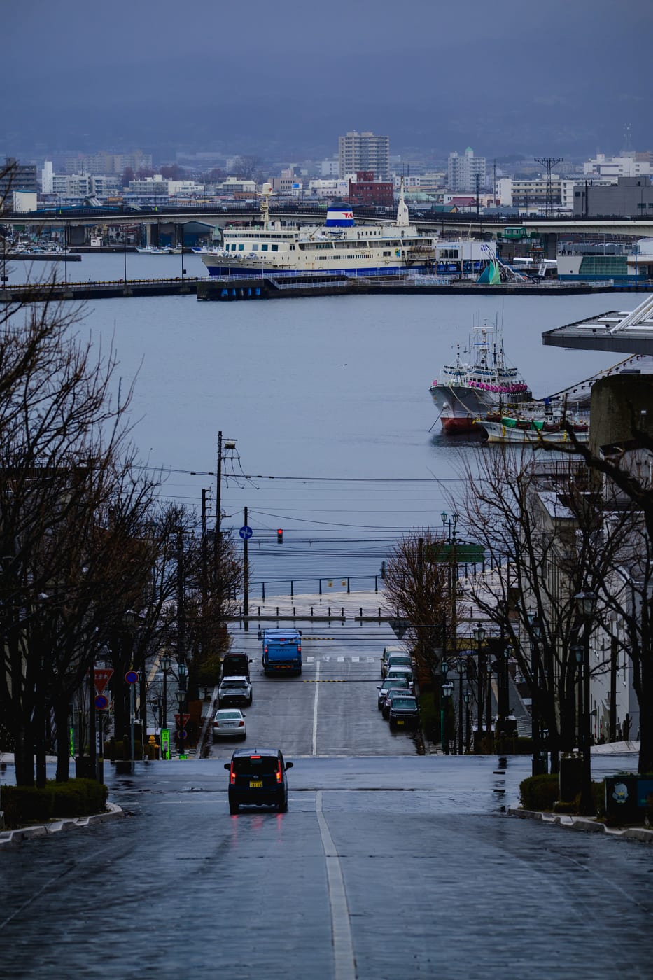 Hakodate Harbor viewed down snow-lined Hachiman-zaka