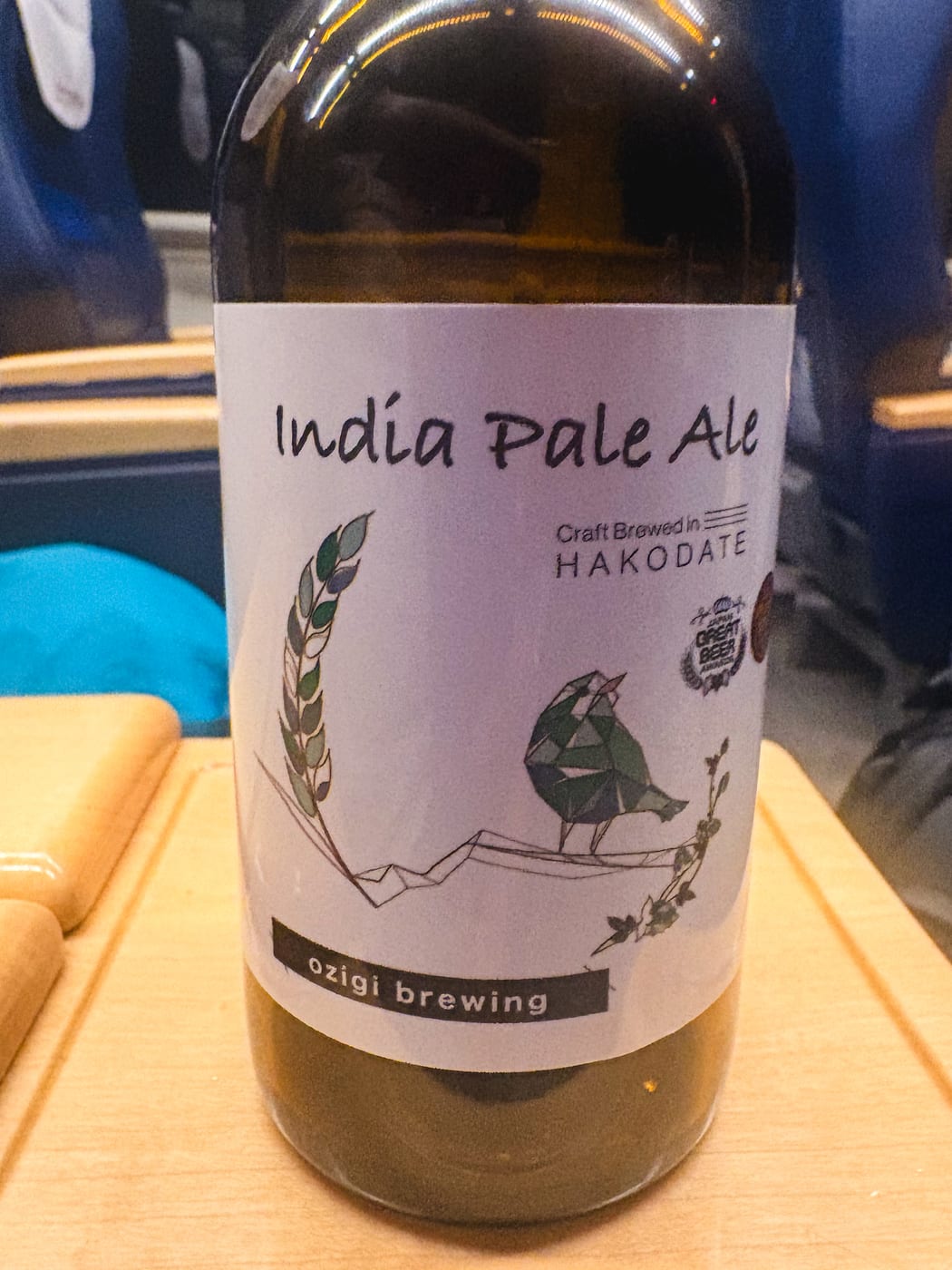A can of Hakodate craft beer on a limited express seat-back table