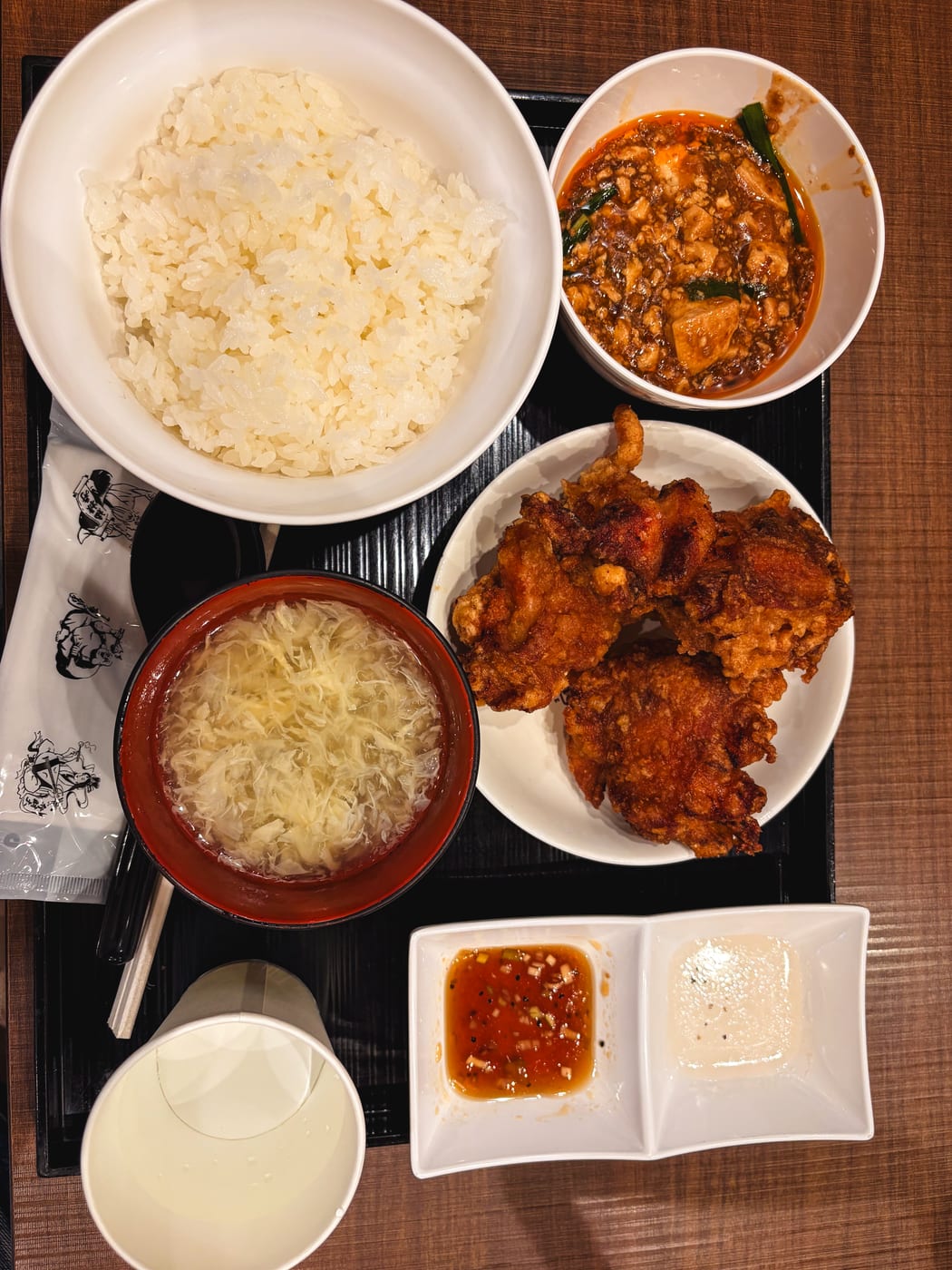 A Hotei set meal with mapo tofu, zangi, rice, and soup