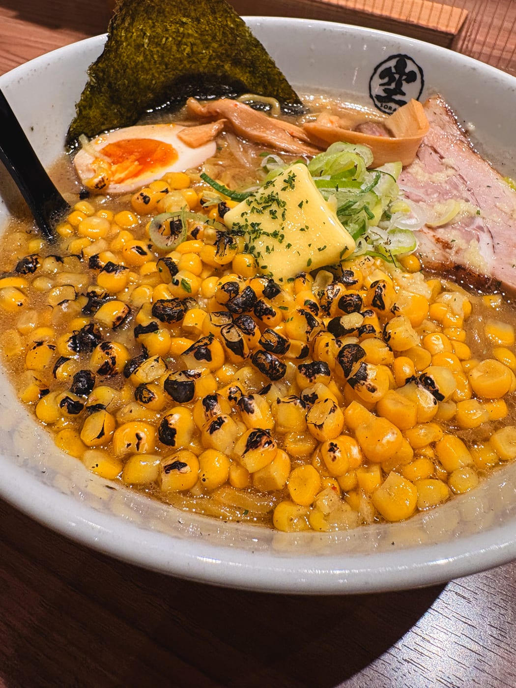 Grilled corn ramen topped with corn and nori at Ramen Sora