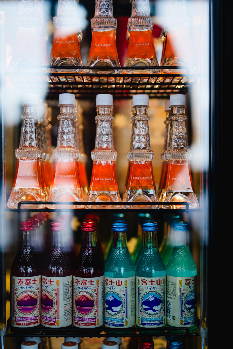 Clear Tokyo Tower-shaped bottles displayed in a shop