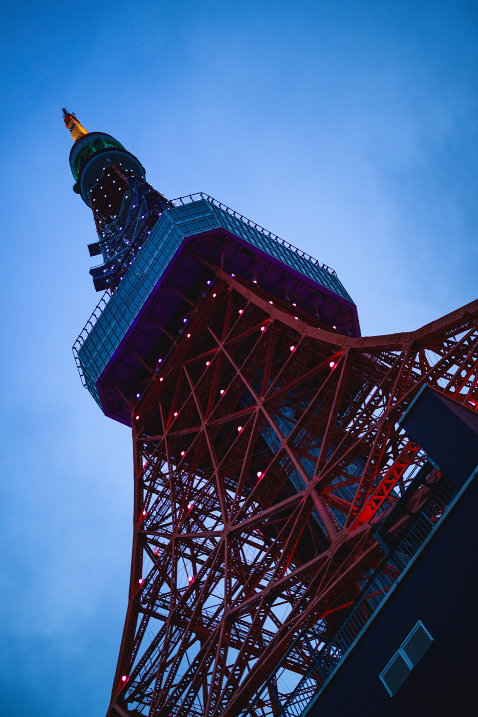 Tokyo Tower's lights beginning to show against the twilight sky