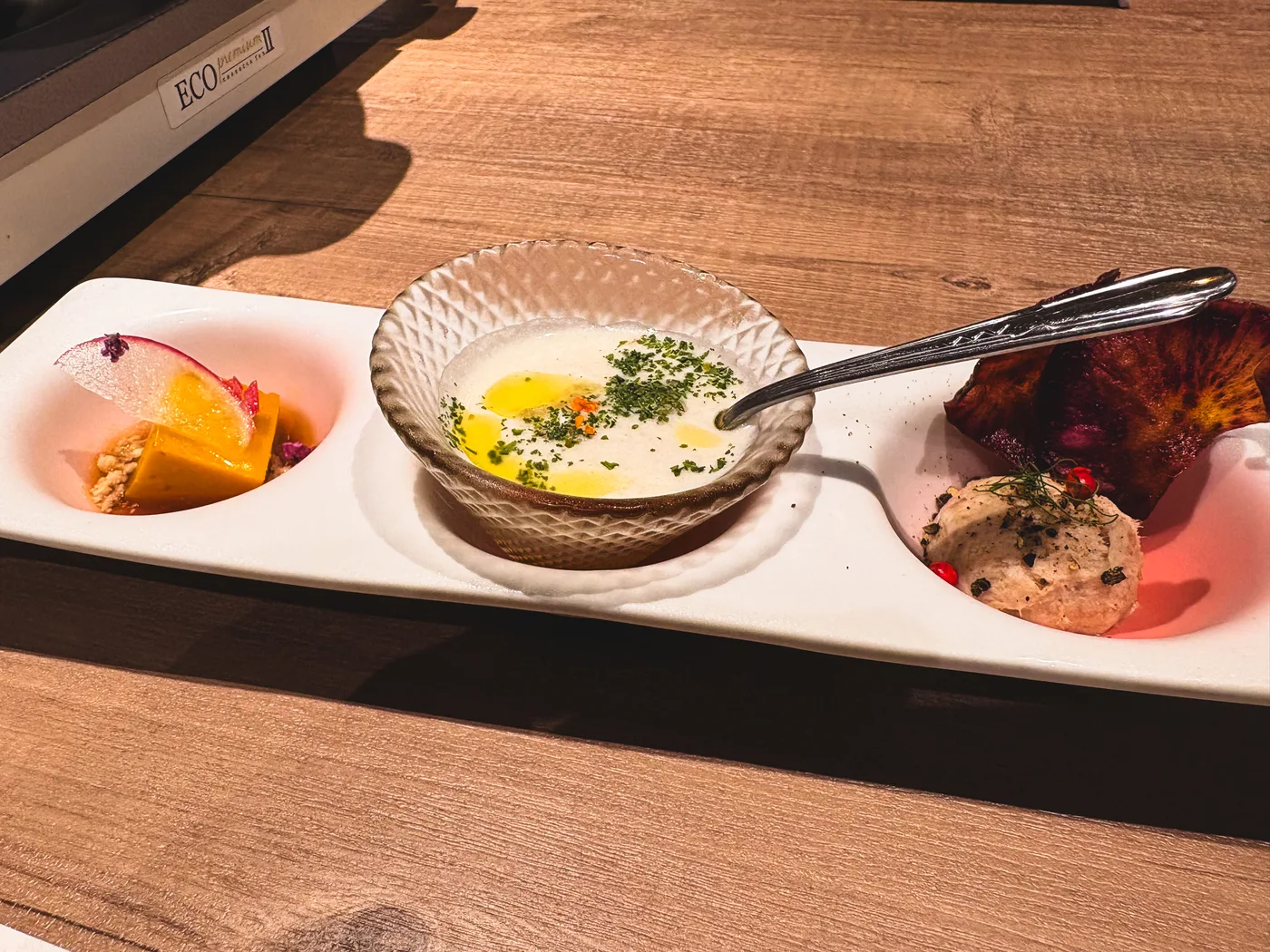 Three small appetizer dishes at the shabu-shabu restaurant