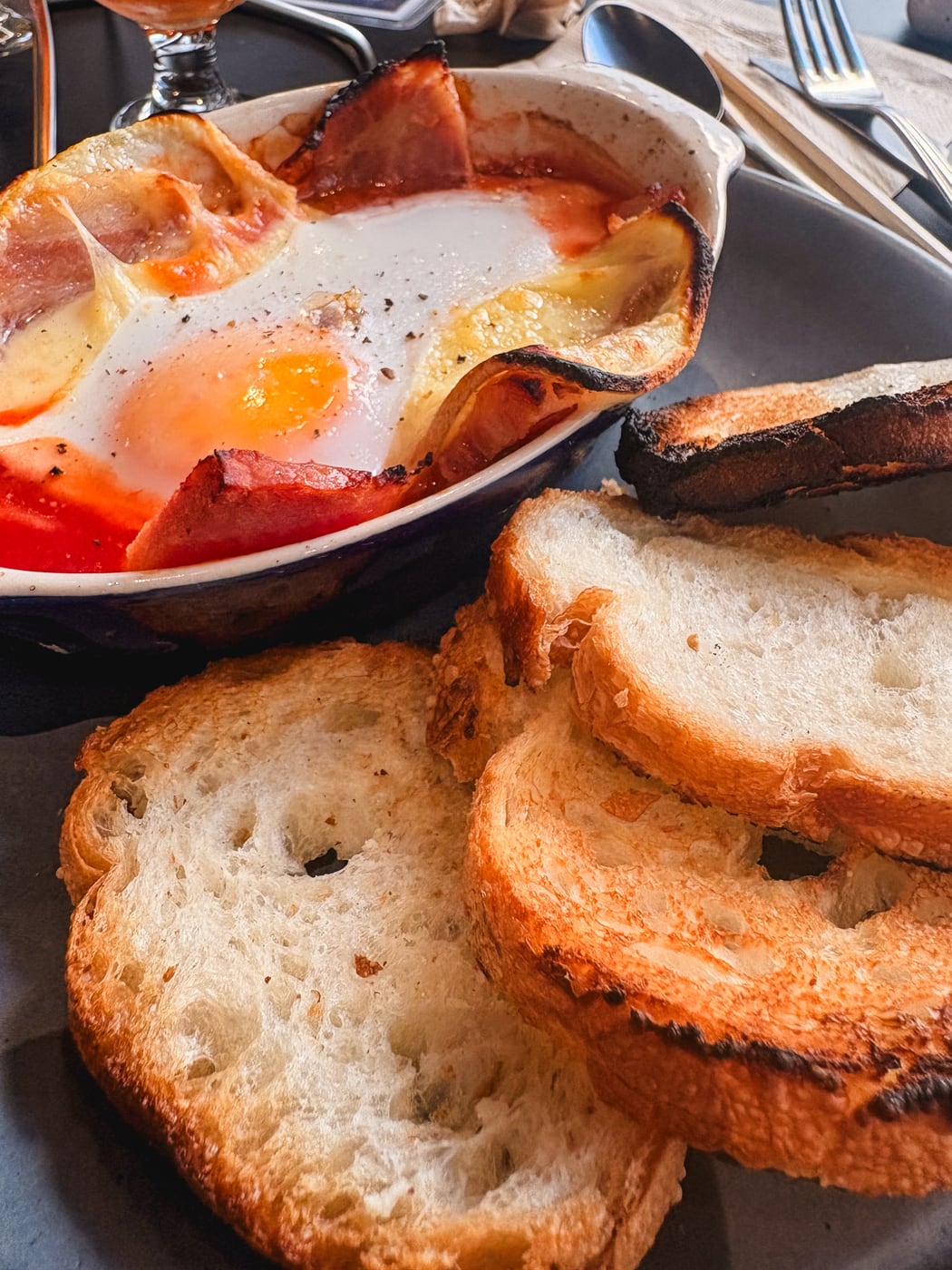 Galette topped with an egg and other ingredients
