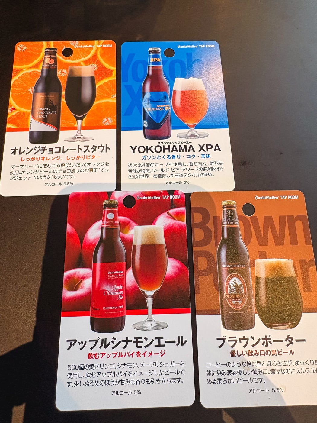 Tasting cards for YOKOHAMA XPA, Brown Porter, Orange Chocolate Stout, and Apple Cinnamon Ale