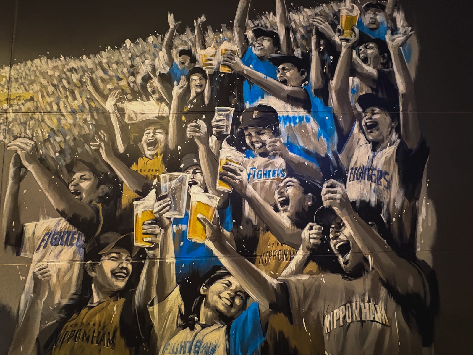 A mural depicting Fighters players and the fans cheering them on