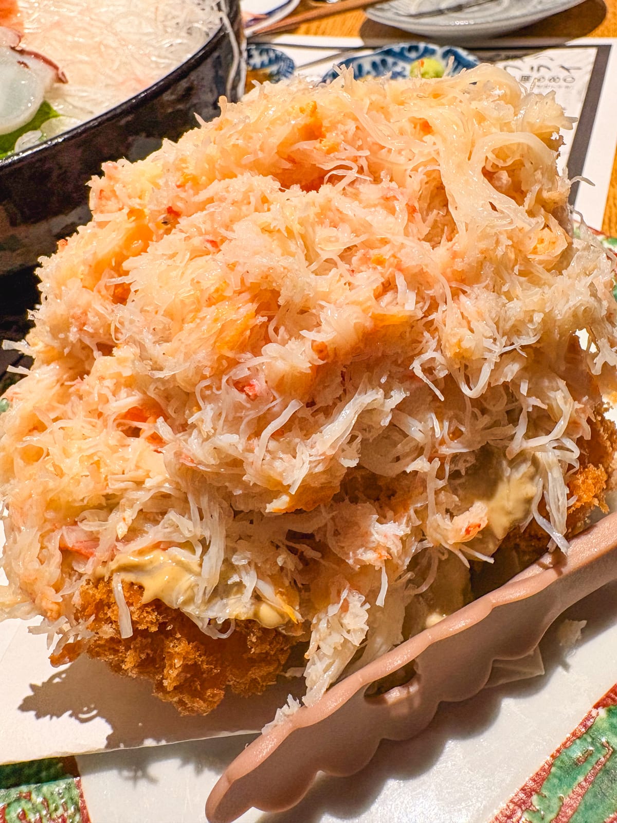 A gratin croquette topped with plenty of shelled crab at Minatomachi no Monkichi
