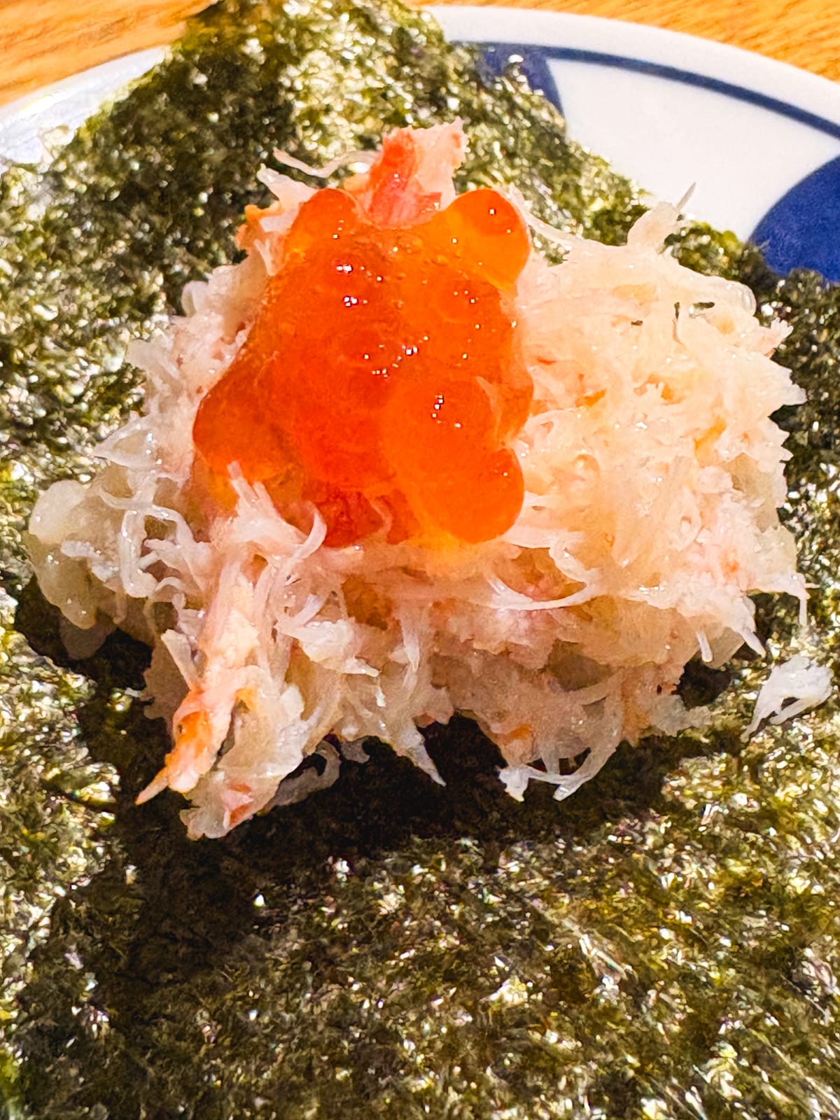 A hand roll with shelled crab and salmon roe served at Minatomachi no Monkichi