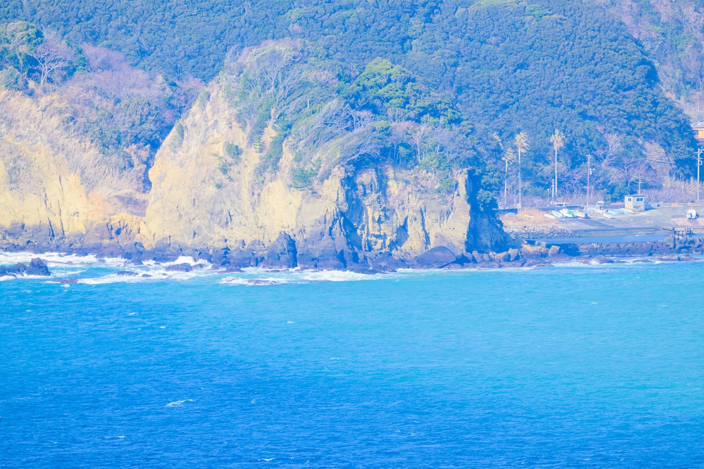 The Dogashima coast with blue water and steep rocky cliffs