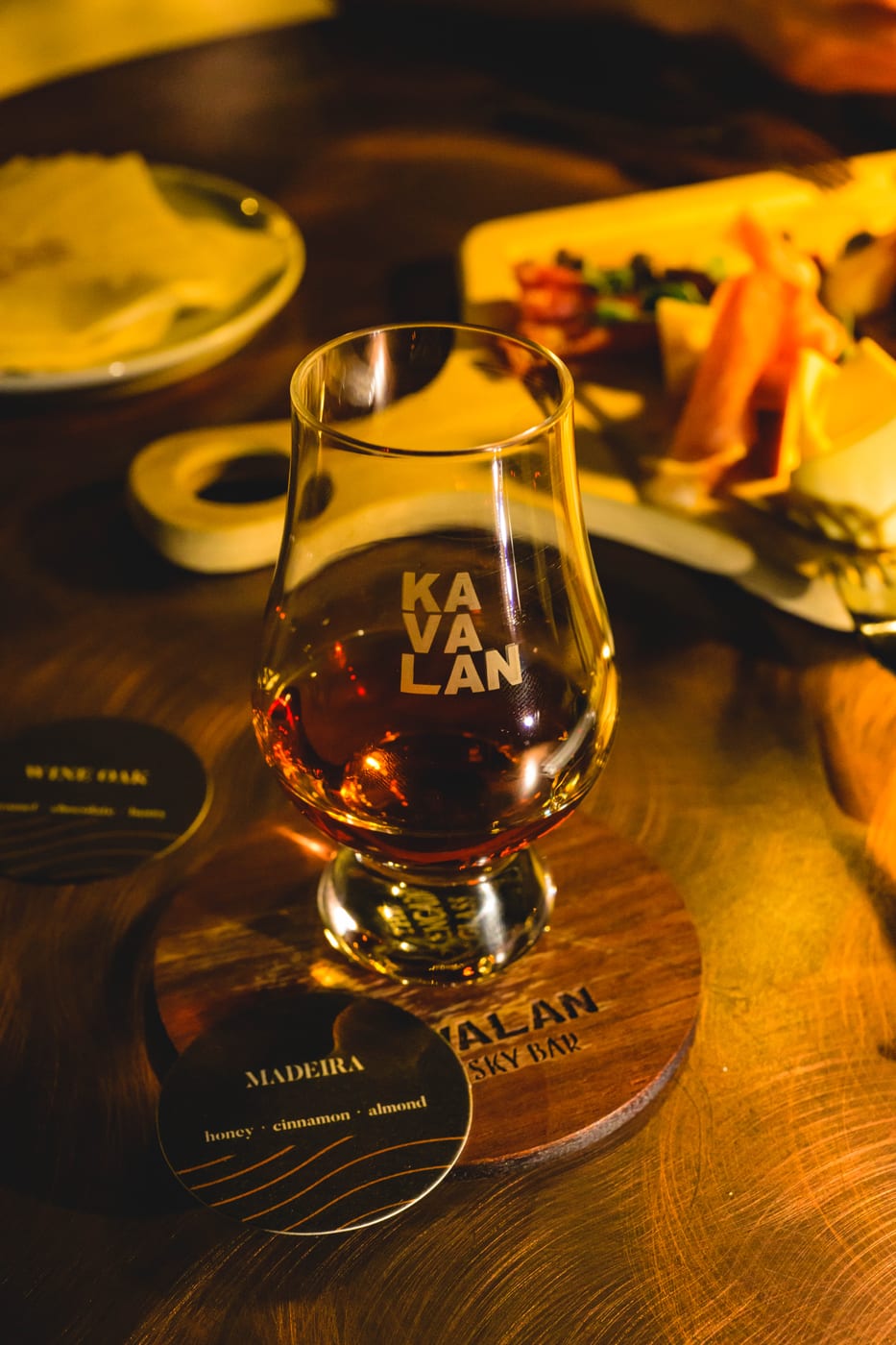 A glass of whisky resting on the counter at KAVALAN WHISKY BAR