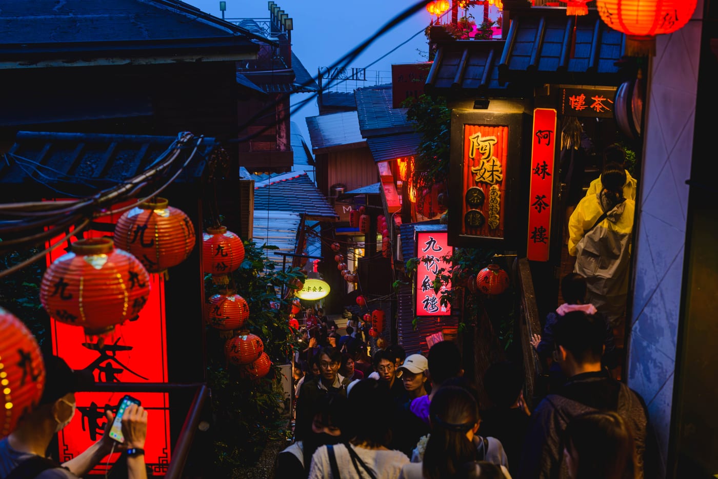 A rainy alley in Jiufen lined with red lanterns