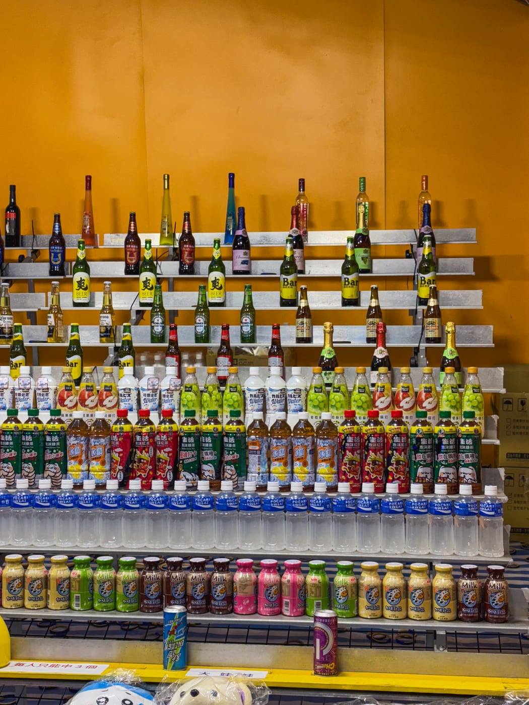 A ring-toss stall at Shilin Night Market where bottles are used as the targets