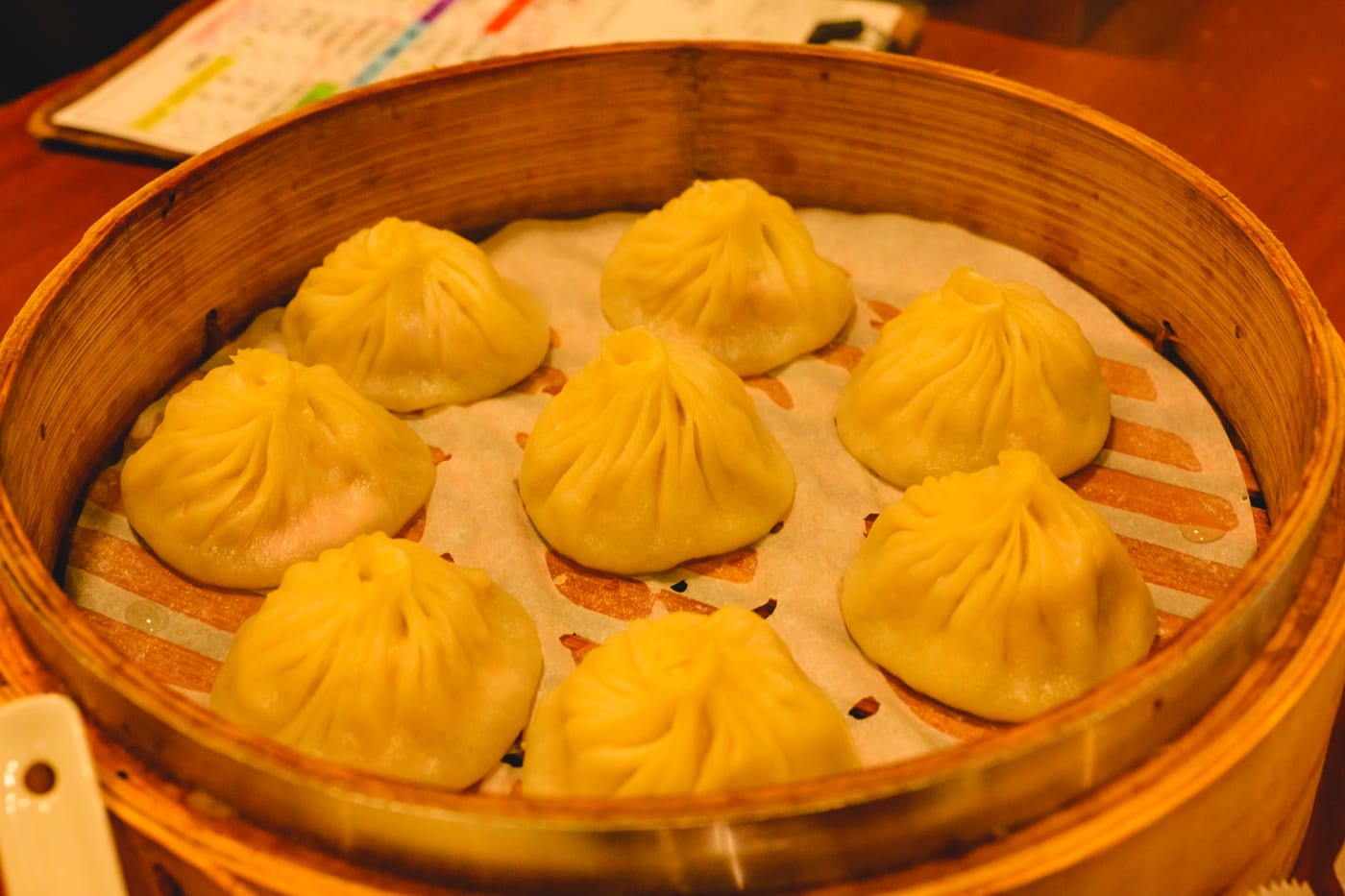 A steamer basket filled with xiao long bao