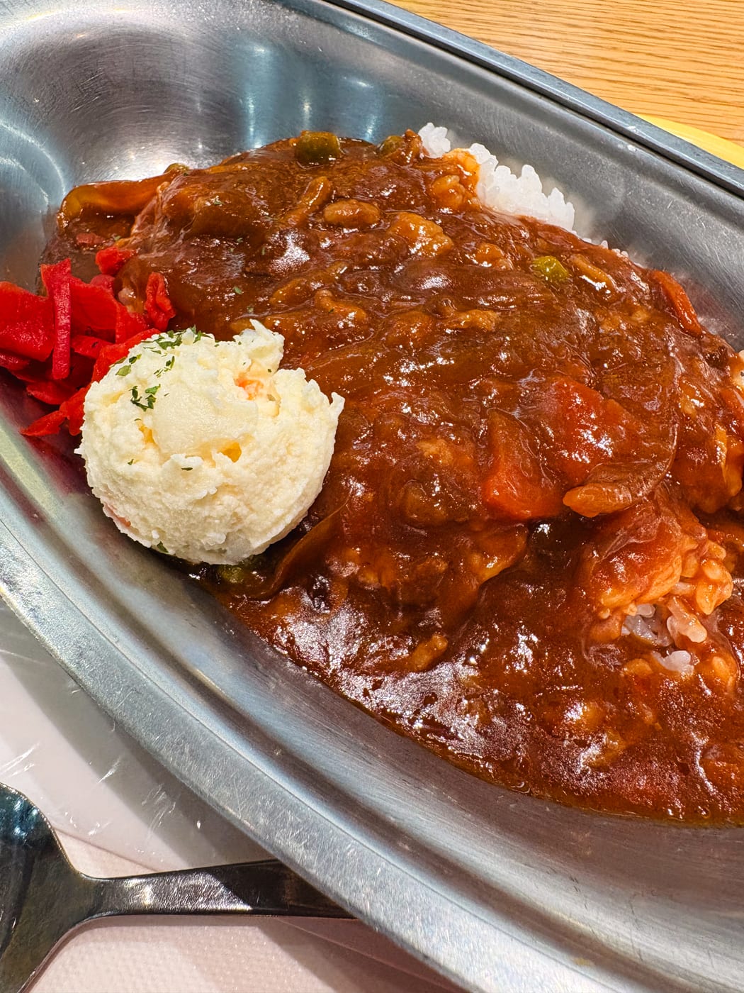 Hayashi rice with dark sauce over white rice