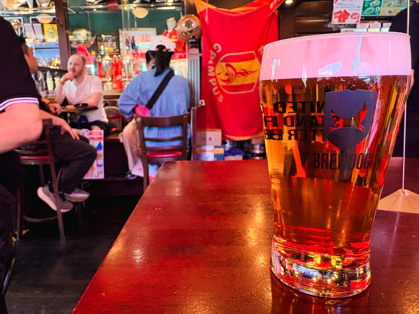 A beer on a table inside HUB